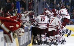 UMass celebrated its Frozen Four semifinal victory over Denver in the 2019 Frozen Four.