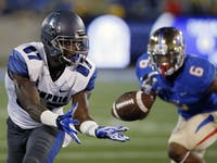 Memphis wide receiver Tevin Jones (87) reaches for a pass in front of Tulsa cornerback Darrell Williams (6) in the first quarter of an NCAA college fo