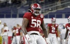 Alabama defensive lineman Christian Barmore (58) celebrates a sack against Notre Dame during a national semifinal game in January. 