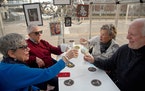 Phyllis and Sheldon Schwartz, left, toast with longtime friends Randy and Rochelle Forester while dining out in downtown Detroit, March 16, 2021. Olde