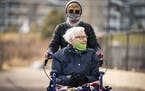 Lynda Lange took her mother MaryAnn Falk, 85, out for a walk around the McKenna Crossing Assisted Living facility in Prior Lake.