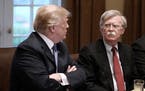U.S. President Donald Trump, left, and John Bolton, right, national security adviser, attend a briefing from Senior Military Leadership in the Cabinet