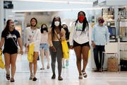 The MOA opened again this month for the first time since mid-March, where most shoppers wore face masks Wednesday, June 10, 2020, in Bloomington, MN.]