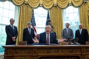 President Donald Trump signed the Paycheck Protection Program and Health Care Enhancement Act in the Oval Office in April.