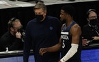 Timberwolves head coach Chris Finch talks to Malik Beasley during the first half of Milwaukee’s win over the Wolves on Tuesday. (AP Photo/Morry Gash