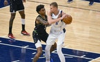 Timberwolves forward Jaden McDaniels guarded Mavericks center Kristaps Porzingis here, but he saved some of his best defense Wednesday night for tryi