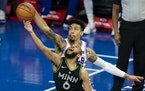 Philadelphia 76ers’ Danny Green, right, blocks a shot attempt by the Timberwolves’ Jordan McLaughlin, left, during the second half 
