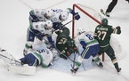 Canucks goalie Jacob Markstrom made a save against the Wild in an August 2020 game. Sixteen of the 22 players on Vancouver’s active roster were on t