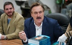 Mike Lindell signed a fresh shipment of his book “What Are the Odds? From Crack Addict to CEO” at the Shakopee factory of his MyPillow business in