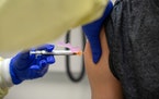 A 15-year-old participating in Moderna’s teen vaccine trial receives a shot in Houston on Feb. 5.