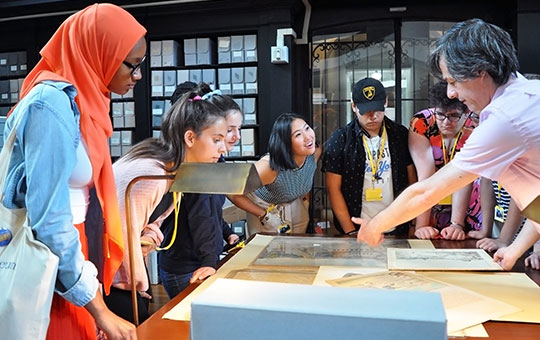 teen summer interns get a tour of museum archives by senior archivist alessandro pezzati