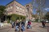 People walk on campus at the University of Southern California in Los Angeles.