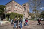 People walk on campus at the University of Southern California in Los Angeles.
