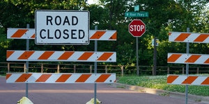Road closure signs blocked off West River Parkway in Minneapolis for walkers and bicyclists in June.