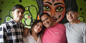 Chef and restaurateur Hector Ruiz with his children, from left, Benjamin, Ena and Shawmen, at his new El Travieso Taqueria in Minnetonka.