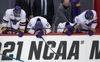 Minnesota State Mankato players hung their heads in disappointment after losing 5-4 in the men’s hockey national semifinal to St. Cloud State.