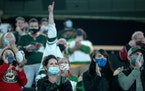 Fans cheered before the start of Monday nightÕs game. 3,000 fans were allowed to attend.              ] CARLOS GONZALEZ ¥ cgonzalez@startribune.com 