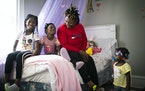 Howanda Williams showed the bedroom she decorated for her oldest daughter Mary, left, who is 8, in their new apartment. Also pictured are William’s 
