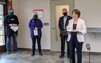 Sen. Amy Klobuchar, D-Minn., speaks with reporters on Wednesday, April 7, 2021, in St. Cloud. Joining her are, from left, Jules’ Bistro owner Donell
