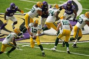 Packers quarterback Aaron Rodgers handed the ball off to Aaron Jones in the fourth quarter.