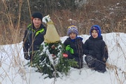 These hunters found the elusive Golden Gnome in a St. Paul park Thursday. From left: Mason Thorson, 7, and Mack and Mace Peterson, both 5. The tree gn