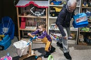 Ceola McClure-Lazo helped grandson Vail, 21 months, test out toys at the Toy Library.