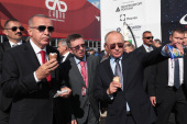 Russian President Vladimir Putin, right, and Turkish President Recep Tayyip Erdogan eat ice cream during the MAKS 2019 International Aviation and Space Salon opening ceremony in Zhukovsky outside Moscow [File: Handout/Turkish Presidency Press Office/AFP]
