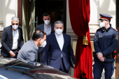 Iran's Deputy Foreign Minister Abbas Araghchi and Iran's ambassador to the UN nuclear watchdog, Kazem Gharibabadi, leave a hotel in Vienna, Austria [Leonhard Foeger/Reuters]