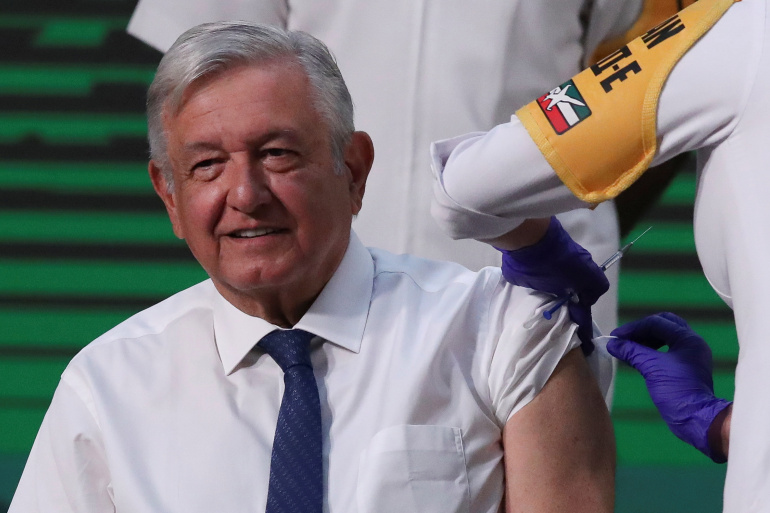 Mexico's President Andres Manuel Lopez Obrador receiving the first dose of the AstraZeneca vaccine on April 20, 2021 [Henry Romero/Reuters]