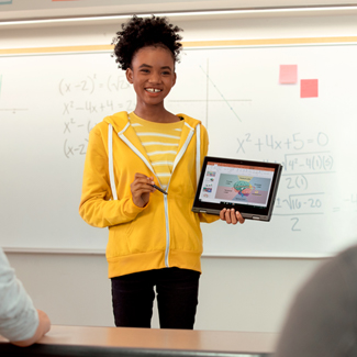 Student presenting on a tablet in a classroom