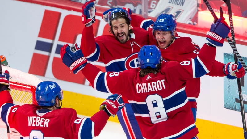 Montreal Canadiens left wing Artturi Lehkonen (62) celebrates with teammates after scoring the winning goal against the Vegas Golden Knights during overtime NHL Stanley Cup playoff hockey semifinal action Thursday, June 24, 2021 in Montreal. THE CANADIAN PRESS/Ryan Remiorz 