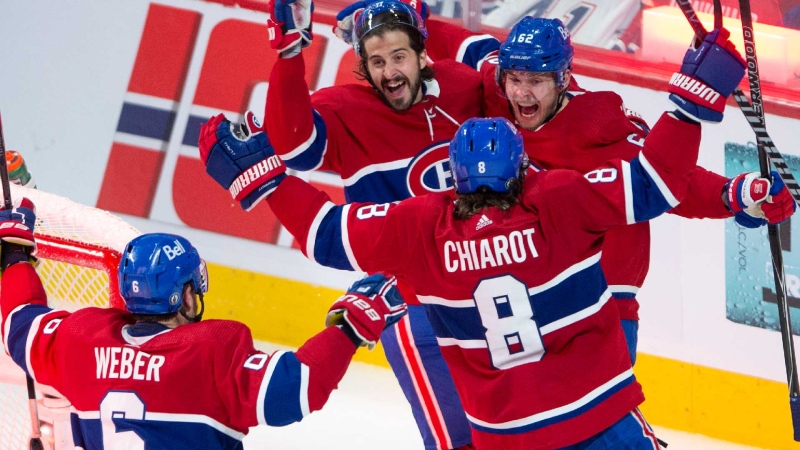 Montreal Canadiens left wing Artturi Lehkonen (62) celebrates with teammates after scoring the winning goal against the Vegas Golden Knights during overtime NHL Stanley Cup playoff hockey semifinal action Thursday, June 24, 2021 in Montreal. THE CANADIAN PRESS/Ryan Remiorz 
