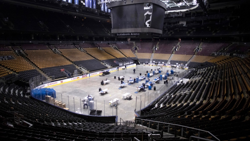 MLSE employees put together meals as they work on the floor of Scotiabank Arena, in Toronto on Wednesday, April 22, 2020. THE CANADIAN PRESS/Chris Young