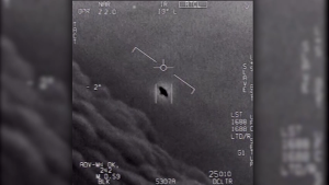 The image from video provided by the Department of Defense labelled Gimbal, from 2015, an unexplained object is seen at center as it is tracked as it soars high along the clouds, traveling against the wind. “There's a whole fleet of them,” one naval aviator tells another, though only one indistinct object is shown. “It's rotating." The U.S. government has been taking a hard look at unidentified flying objects, under orders from Congress, and a report summarizing what officials know is expected to come out in June 2021. (Department of Defense via AP) 