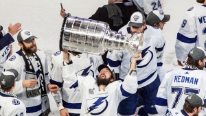  In this Sept. 28, 2020, file photo, Tampa Bay Lightning's Nikita Kucherov (86) hoists the Stanley Cup after defeating the Dallas Stars in the NHL Stanley Cup hockey finals, in Edmonton, Alberta. (Jason Franson/The Canadian Press via AP, File)