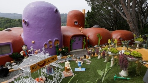 The Flintstone House is seen before a news conference with the owner and the home's original architect Thursday, April 11, 2019, in Hillsborough, Calif. (AP Photo/Eric Risberg) 