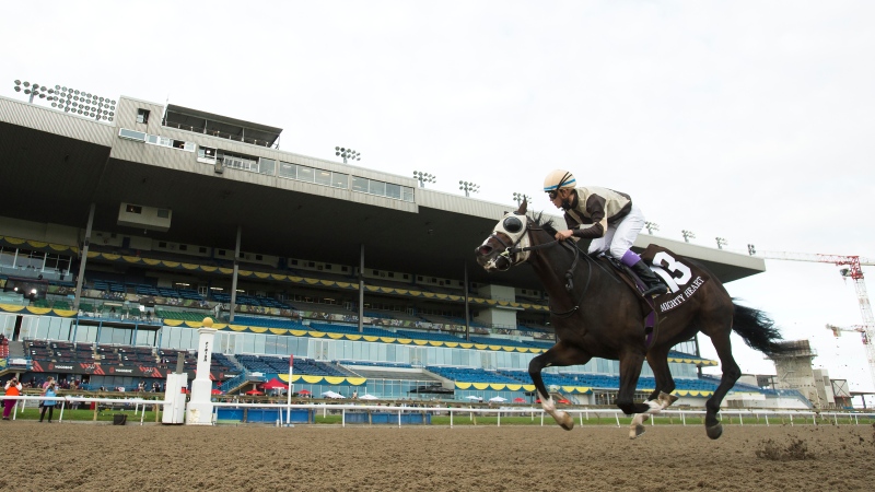 Mighty Heart with jockey Daisuke Fukumoto rides to victory during the running of the 161st Queen's Plate at Woodbine Racetrack in Toronto on Saturday, September 12, 2020. THE CANADIAN PRESS/Nathan Denette