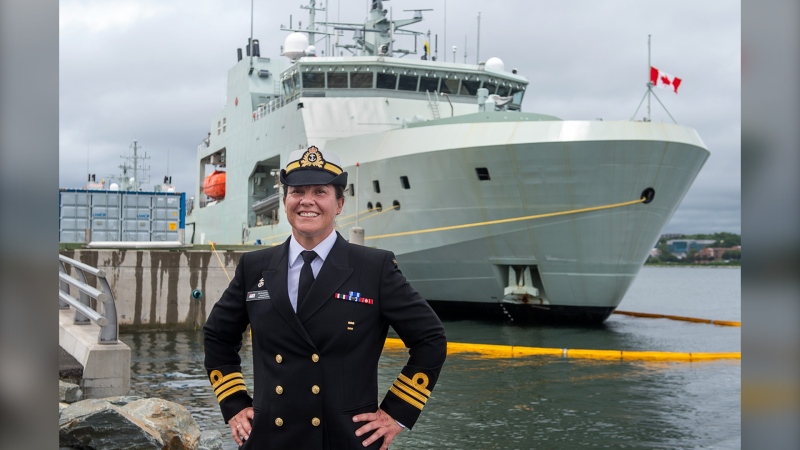 Cmdr. Nicole Robichaud, commanding officer of the future HMCS Margaret Brooke, stands near the bow before a ceremony as the second Arctic and Offshore Patrol Ship (AOPS) is delivered to the Royal Canadian Navy from Irving Shipbuilding in Halifax on Thursday, July 15, 2021. The vessel is named in honour of the Royal Canadian Navy Nursing Sister Lieutenant-Commander Margaret, Martha Brooke, who was decorated for gallantry during the Second World War. (THE CANADIAN PRESS/Andrew Vaughan)