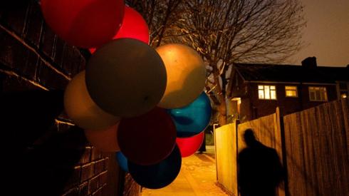 Balloons in an alleyway
