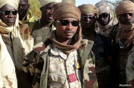FILE PHOTO: Mahamat Idriss Deby Itno and Chadian army officers gather in the northeastern town of Kidal