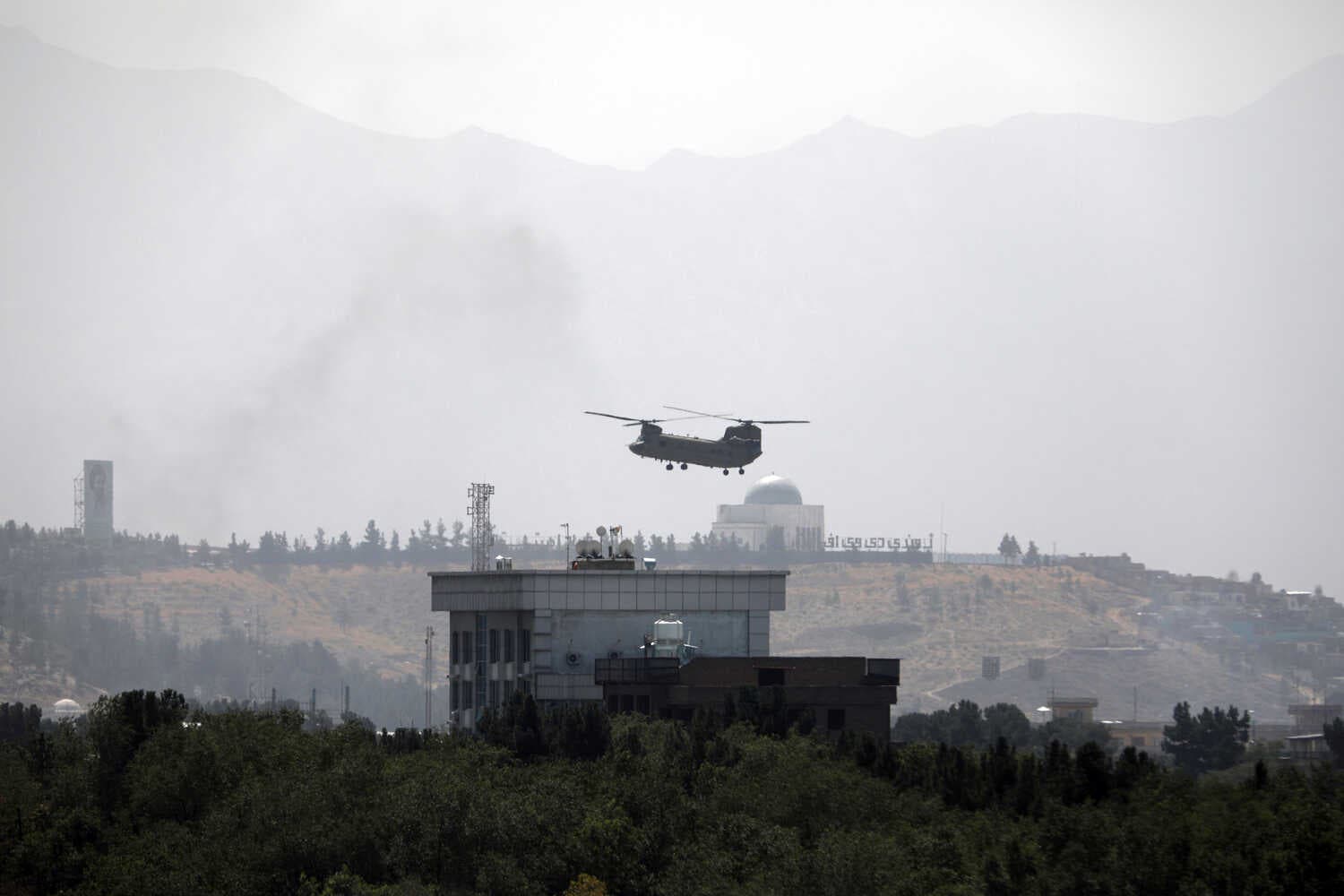 A U.S. Chinook helicopter flew over the American Embassy in Kabul, Afghanistan, on Sunday.