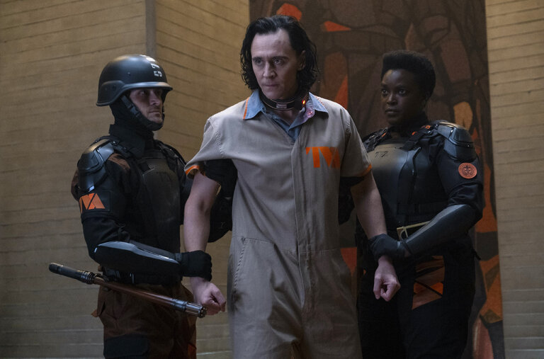 Tom Hiddleston, center, and Wunmi Mosaku, right, in “Loki,” the latest Marvel-Disney+ production to show a self-conscious desire to be more than a typical superhero series.