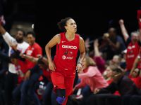 Former Washington Mystics, current LA Sparks guard Kristi Toliver celebrates after her three-point basket during the first half of Game 5 of basketball's WNBA Finals against the Connecticut Sun, Thursday, Oct. 10, 2019, in Washington.