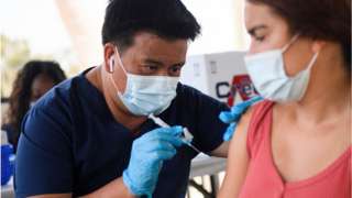 A person getting vaccinated in California