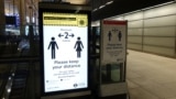  A sign regarding social distancing is seen at the Canary Wharf station, following the outbreak of the coronavirus disease (COVID-19), London, Britain, May 4, 2020. (REUTERS/Adam Oliver)
