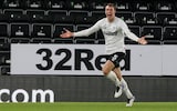Krystian Bielik of Derby County scores a goal to make it 1-0 and celebrates during the Sky Bet Championship match between Derby County and AFC Bournemouth at Pride Park Stadium on January 19, 2021 in Derby, England. 