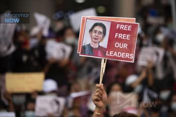 A protester holds a placard with Aung San Suu Kyi’s picture during an anti-coup rally in Yangon on February 9 (Myanmar Now)