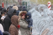At least a dozen refugees have so far reportedly died in sub-zero temperatures along the Belarus-Poland border, but the real number is believed to be higher [File: Leonid Scheglov/Reuters]