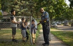 In June, St. Paul police officer Mahamed Dahir stopped to chat with some kids and offer them stickers while he and his partner stopped to investigate 