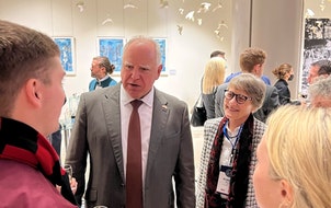 Gov. Tim Walz and St. Cloud State President Robbyn Wacker chat with SCSU students studying in Alnwick, England, during a November 2021 trade trip to t